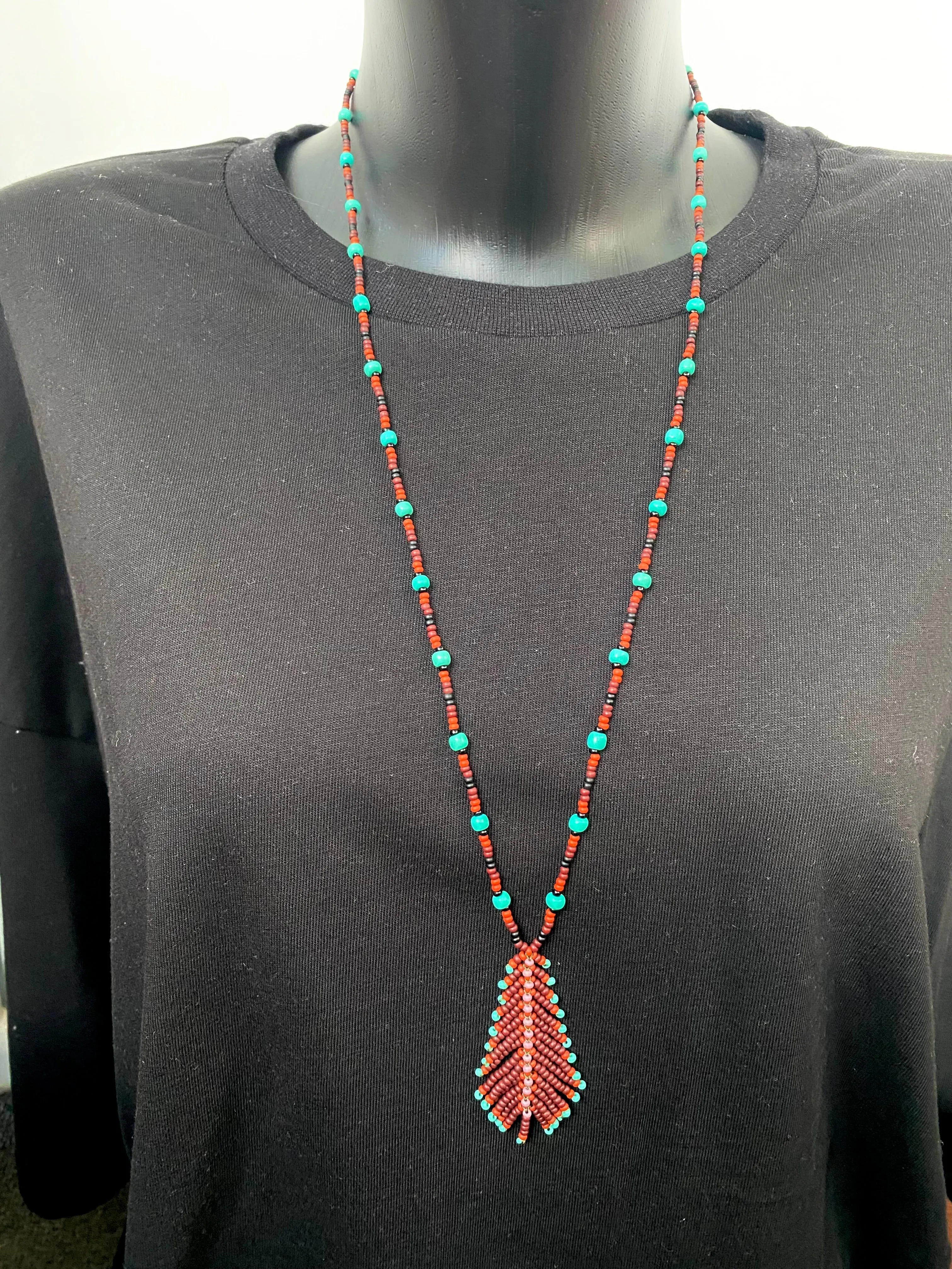 Handmade Seed Bead Feather Pendant Necklace for Women and Men in Boho Hippie style.