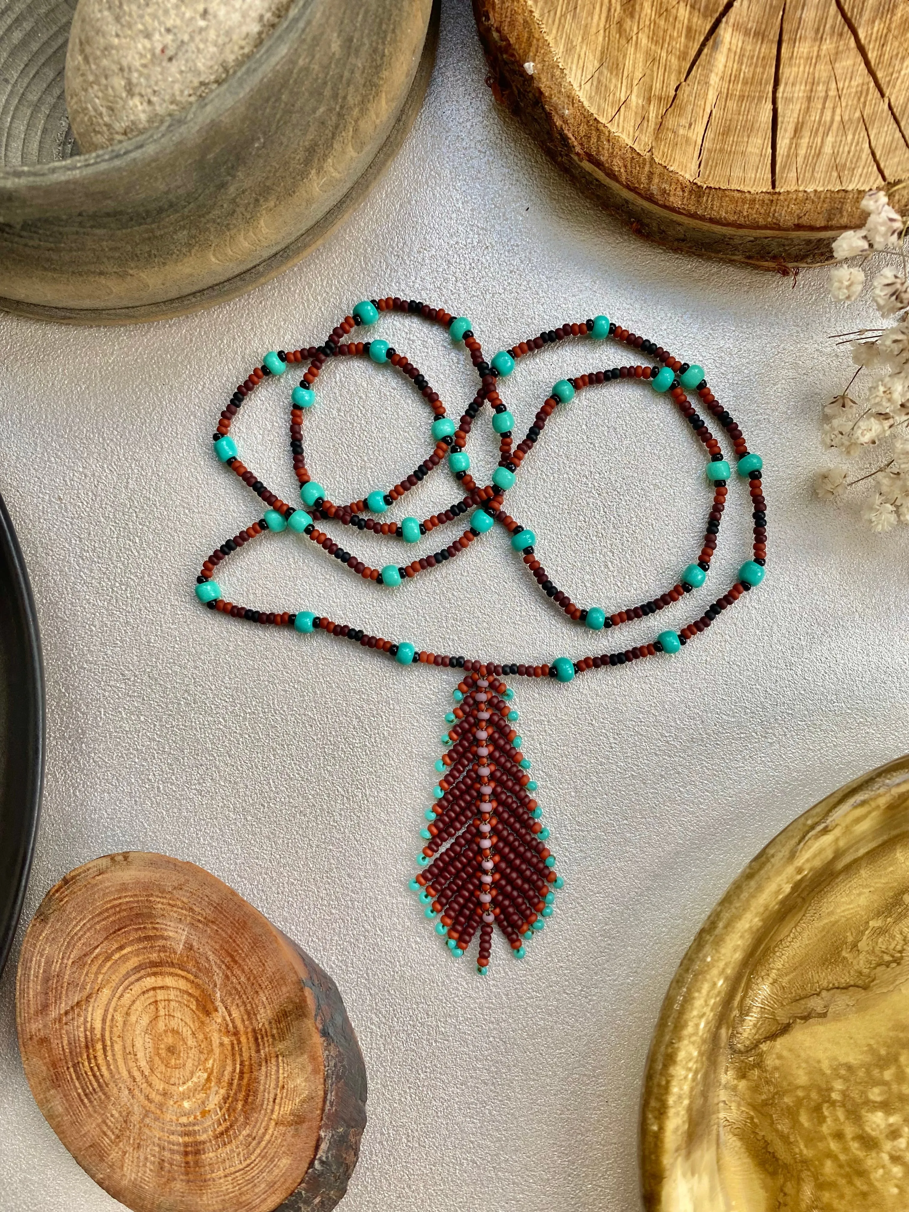 Handmade Seed Bead Feather Pendant Necklace for Women and Men in Boho Hippie style.